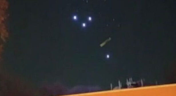 “Cluster of 200 UFOs” hovering in the sky filmed by Reddit user 2