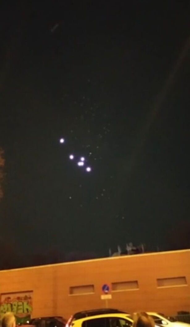 “Cluster of 200 UFOs” hovering in the sky filmed by Reddit user 3